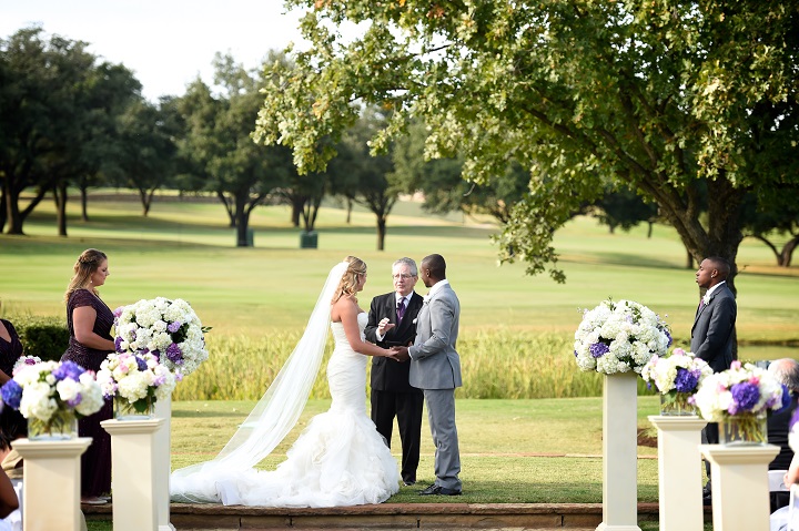 four_seasons_Dallas_Purple_outdoor_wedding_swank_soiree_wedding_planner_alter_bride_groom.jpg
